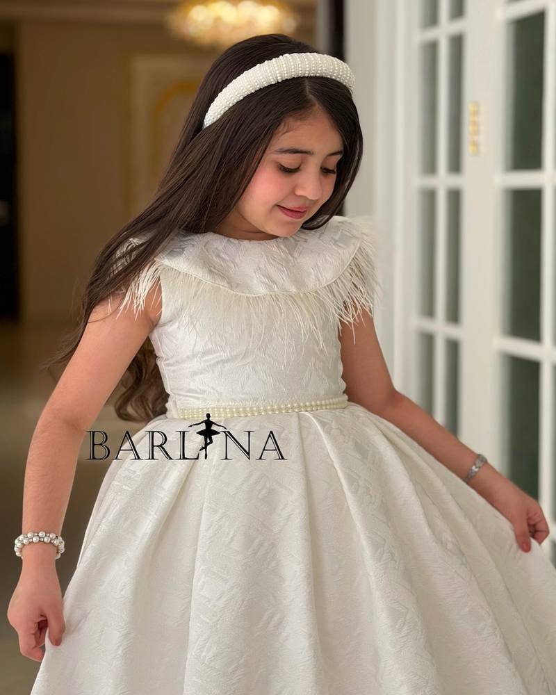white girl's dress with a feather-trimmed collar