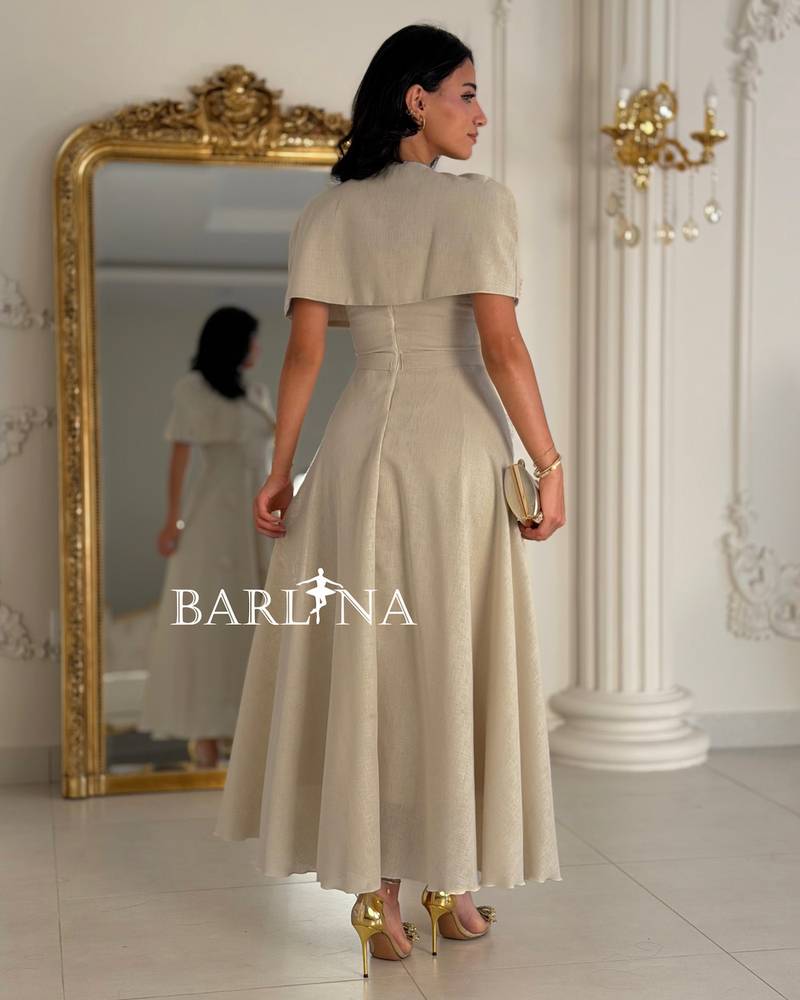 Beige midi dress with a soft cut and prominent roses