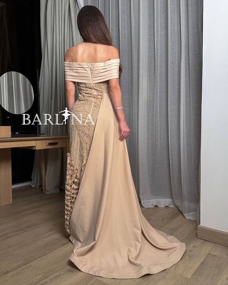 Beige off-shoulder embroidered dress with a soft train