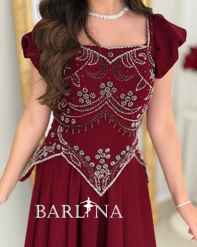 A flowing red dress with elegant beadwork
