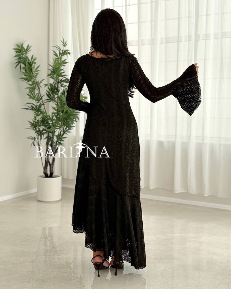 Black asymmetrical dress with a soft ruffled touch