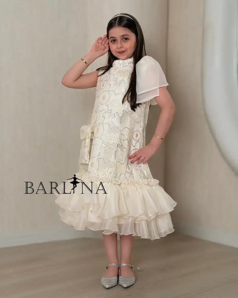 Girls' embroidered dress with ruffles at the bottom