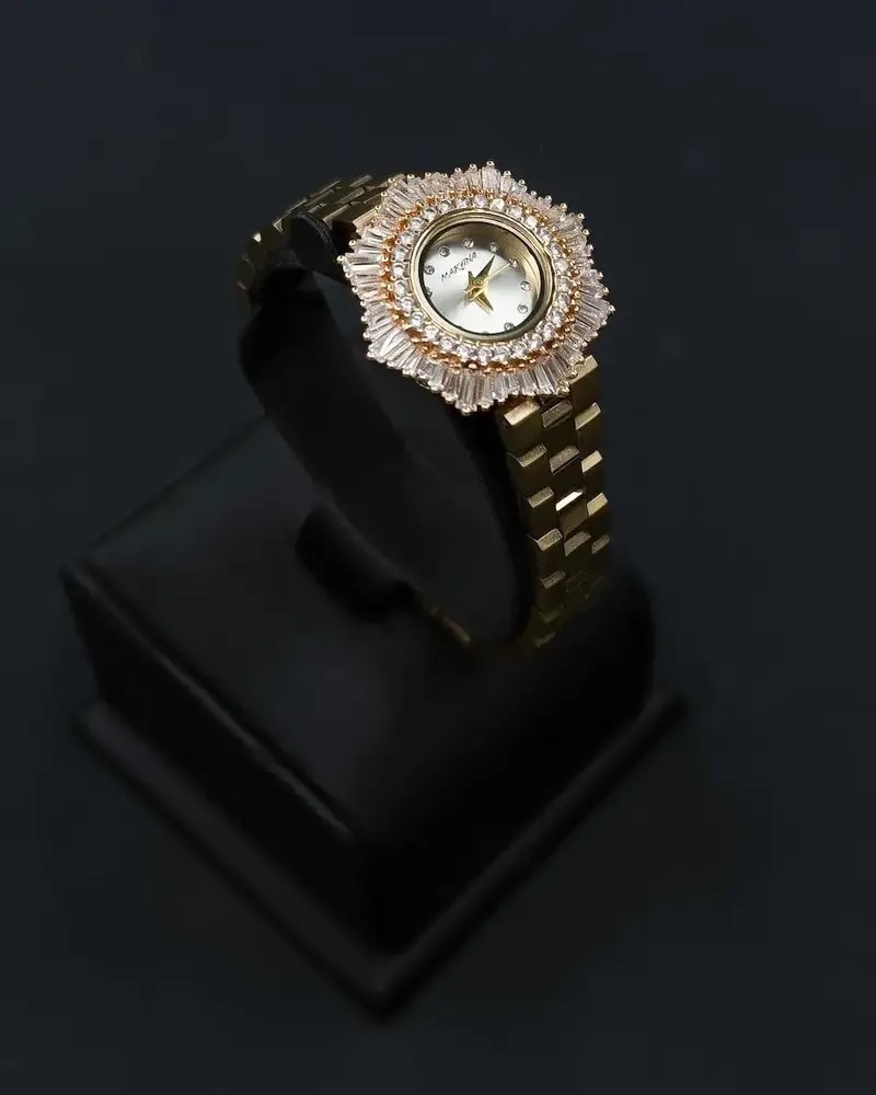 Elegant women's watch with a round studded bezel