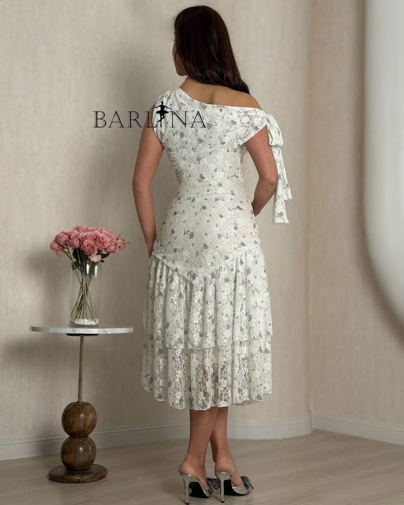 A dress with delicate details and light lace layers