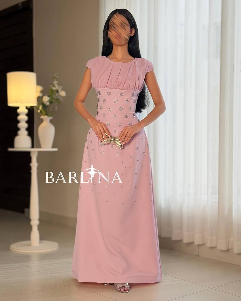 Occasion dress with a fitted waist and scattered crystals