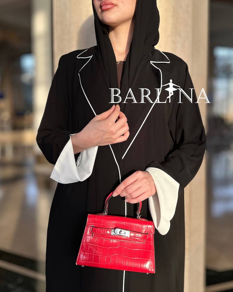 Black abaya with prominent white details