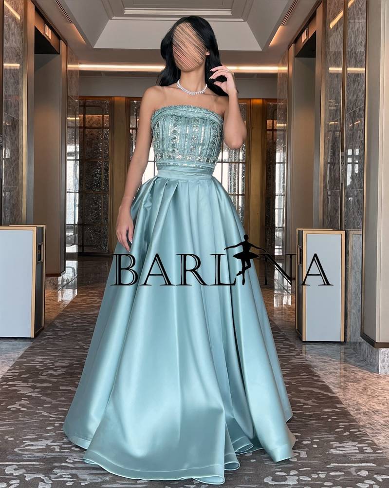 Two piece dress decorated with beads and pearls
