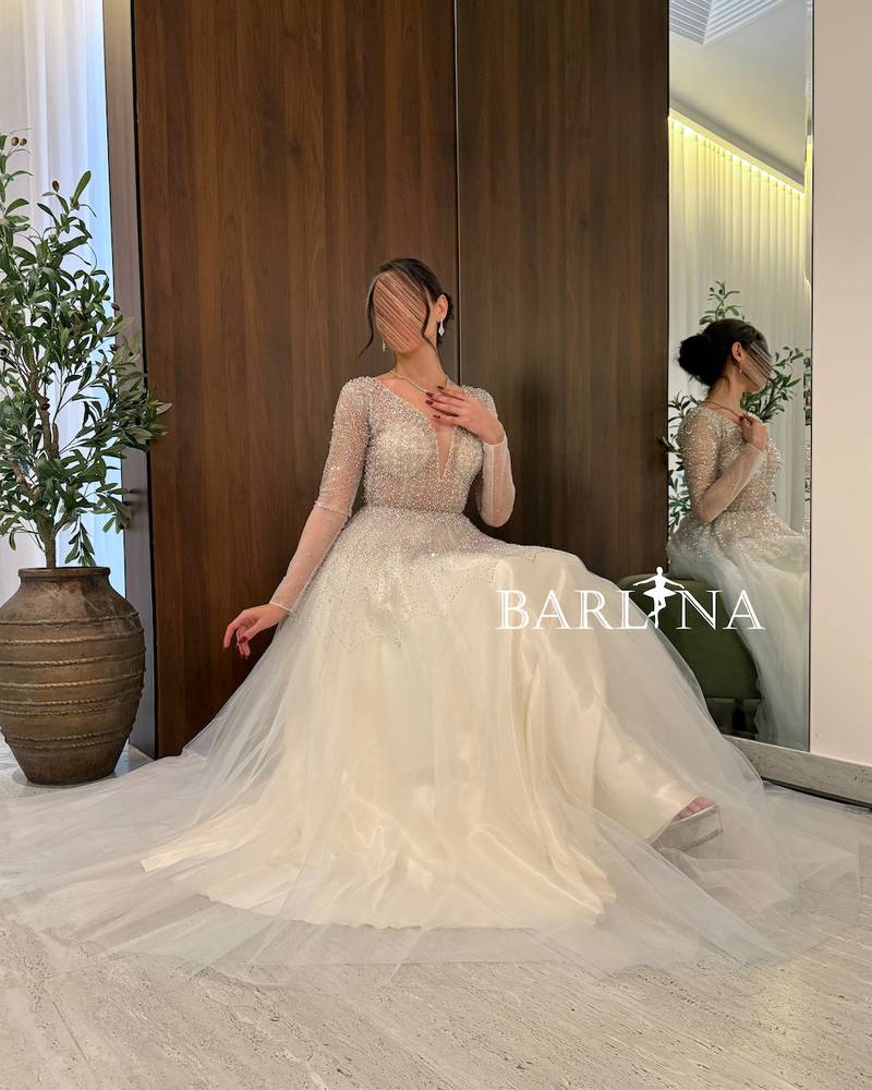  dress with luxurious embroidery and transparent sleeves