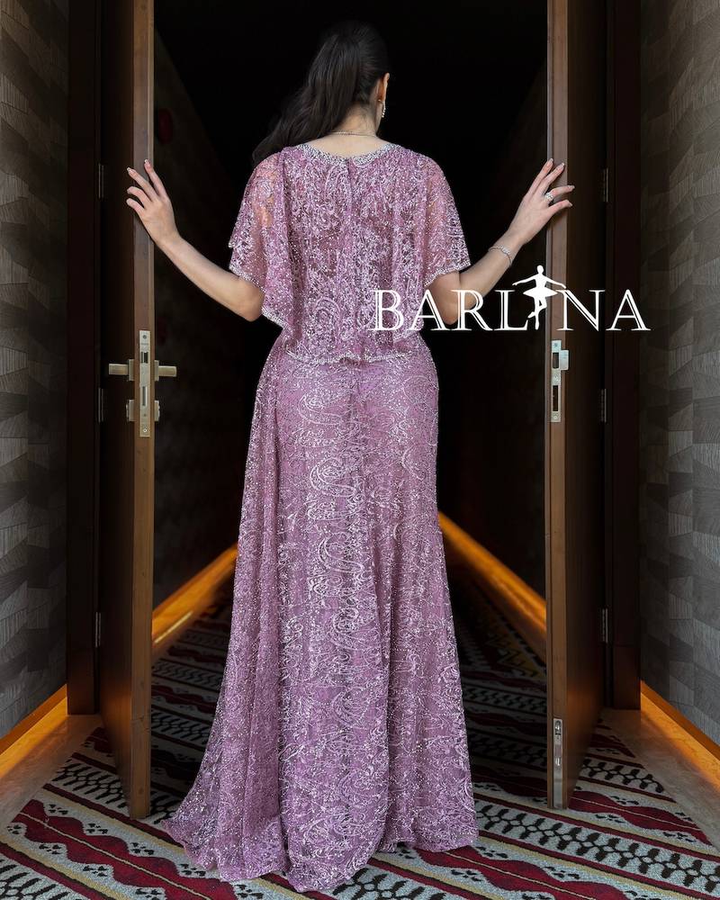 Pink dress with delicate embroidery and a side train