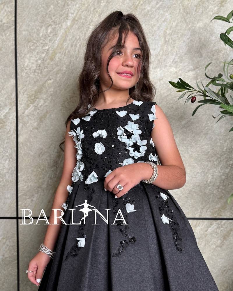 Girls' black dress decorated with sky blue roses