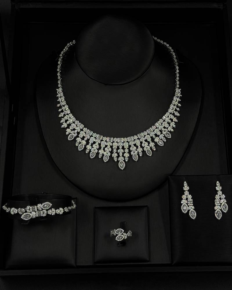 An evening accessory set intricately adorned with diamonds
