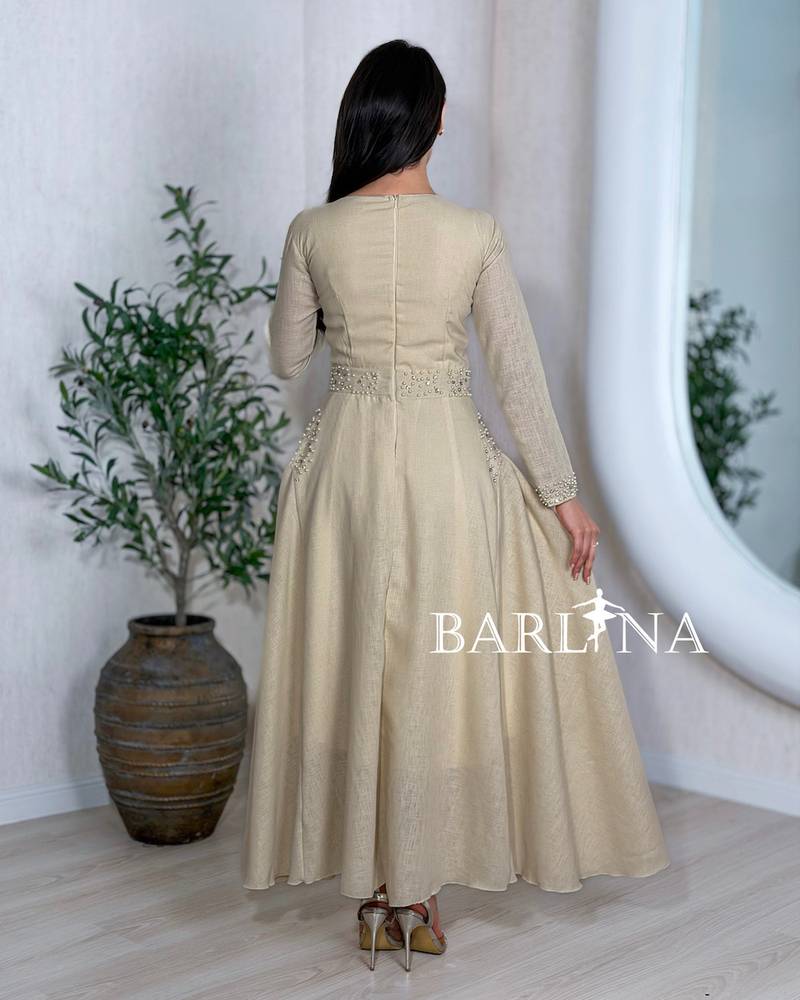 Long beige jalabiya with delicate beaded details