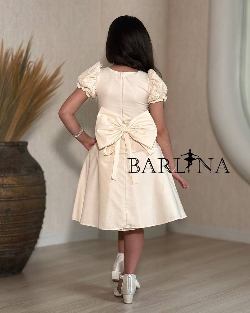 Beige girls' dress with butterfly print fabric