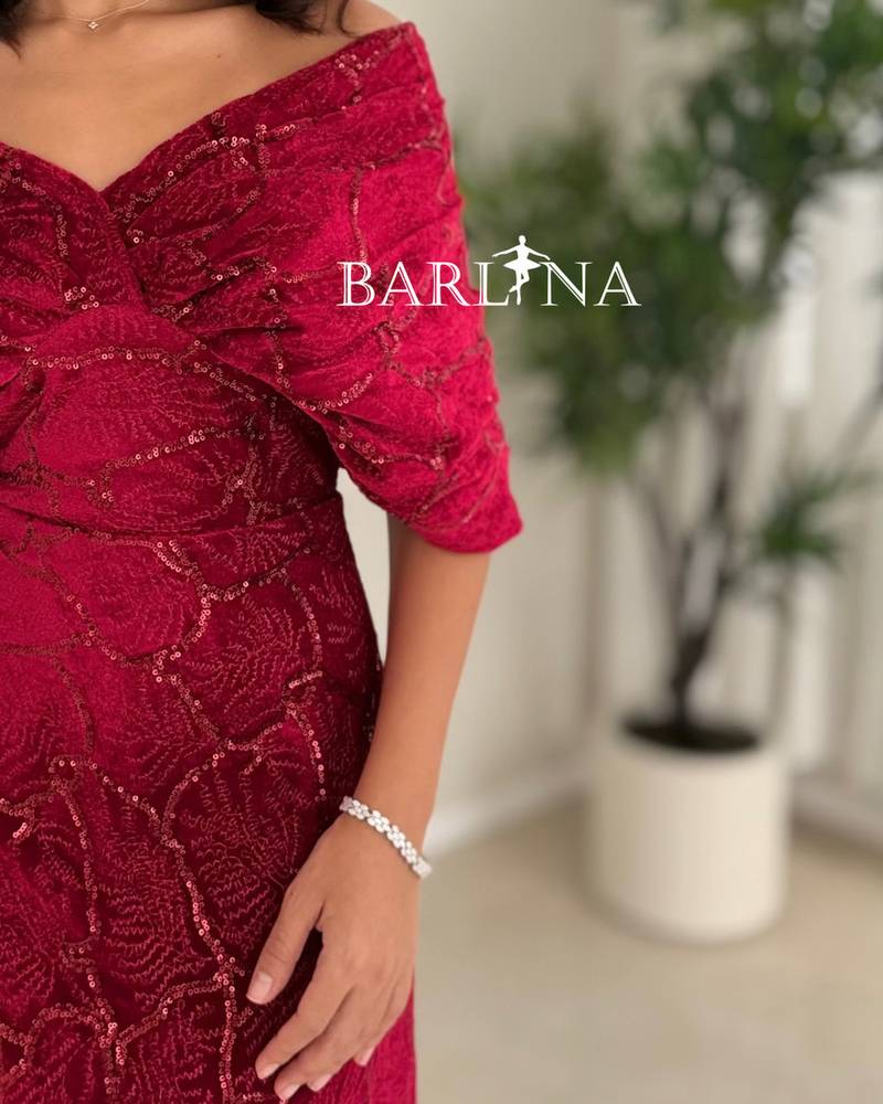 A red dress with an elegant design and luxurious embroidery.