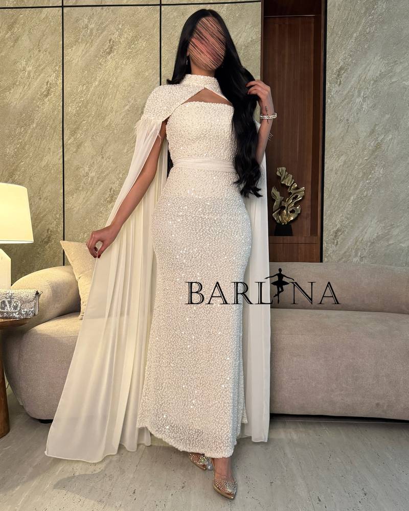 White dress with pearl embroidery and a transparent cape
