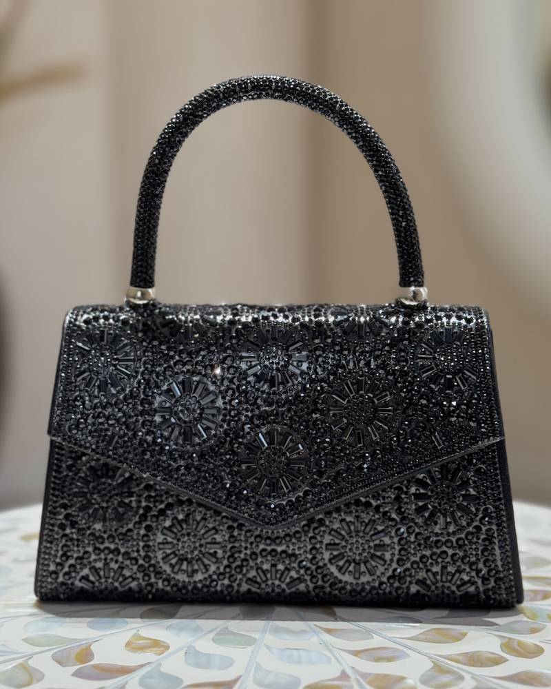 A luxurious handbag covered in crystal beads
