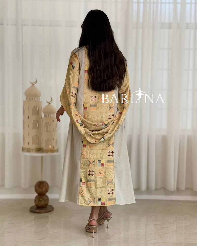 Beige jalabiya with delicate embroidery details at the top