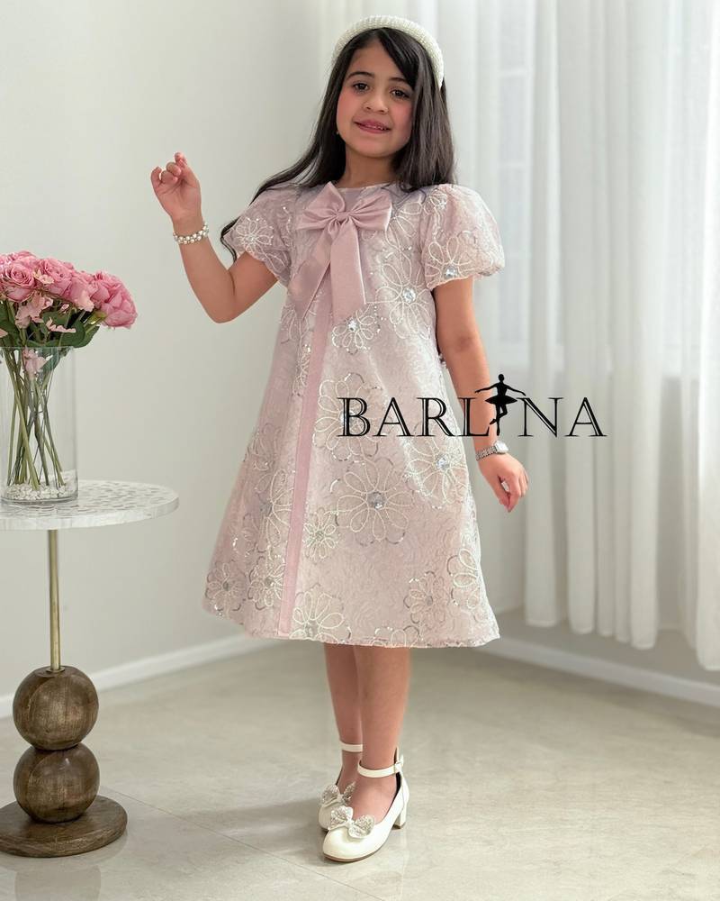 Pink girl's dress with floral embroidery and a bow
