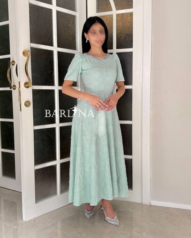 Soft Tiffany dress with a round back opening