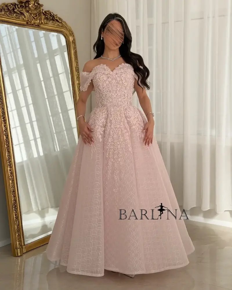 A pink puffy evening dress adorned with delicate embroidery