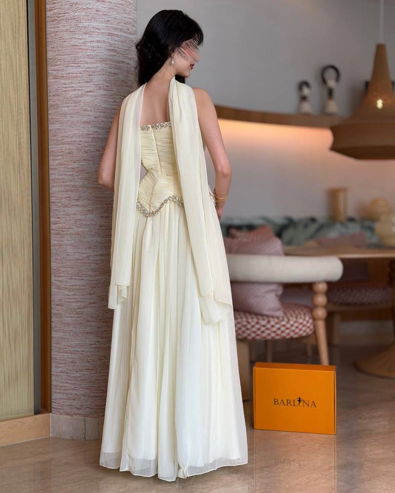 Off-white evening dress with crystal details