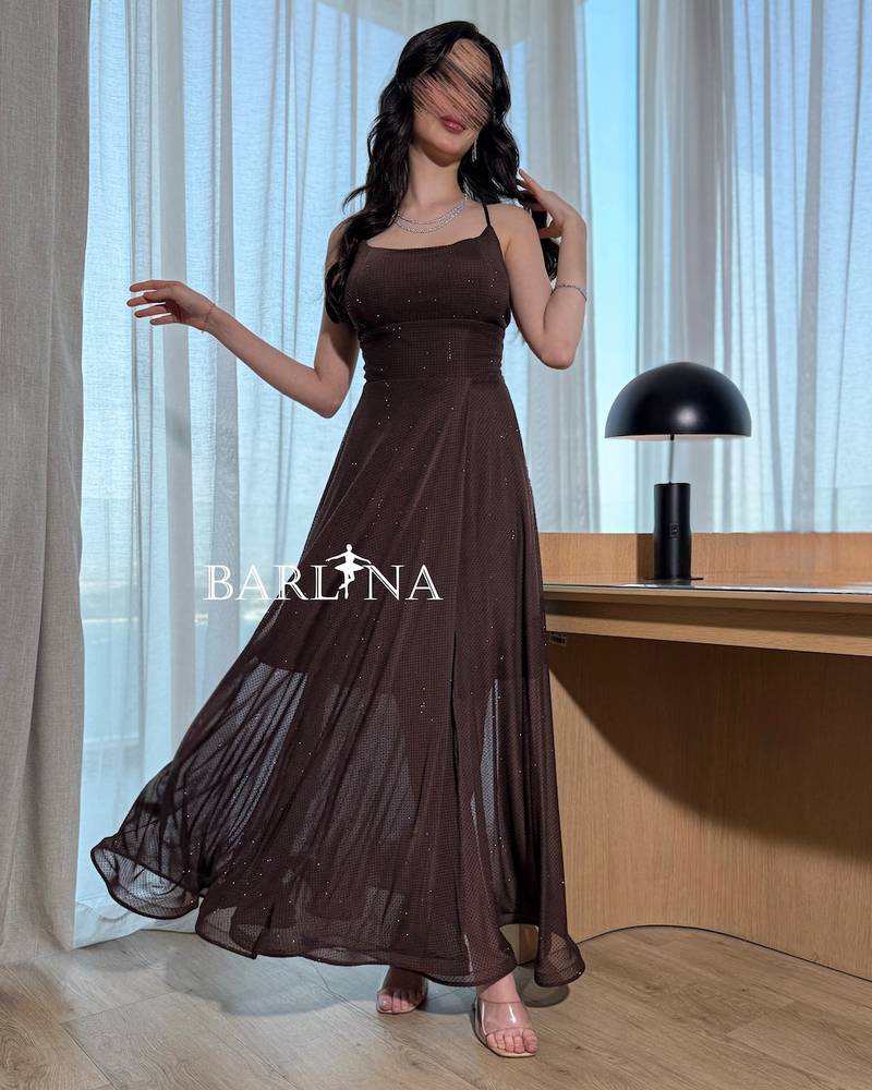 A dark brown sparkly dress with thin straps