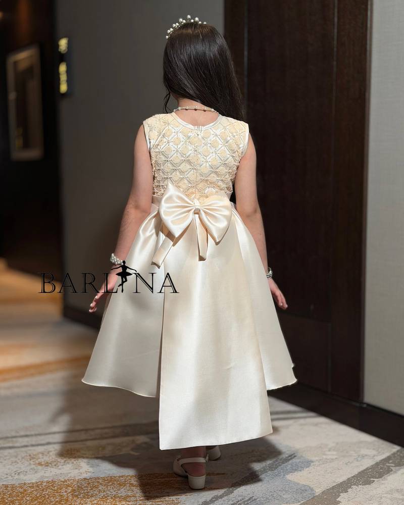 Beige girls' dress with a gold embroidered bodice
