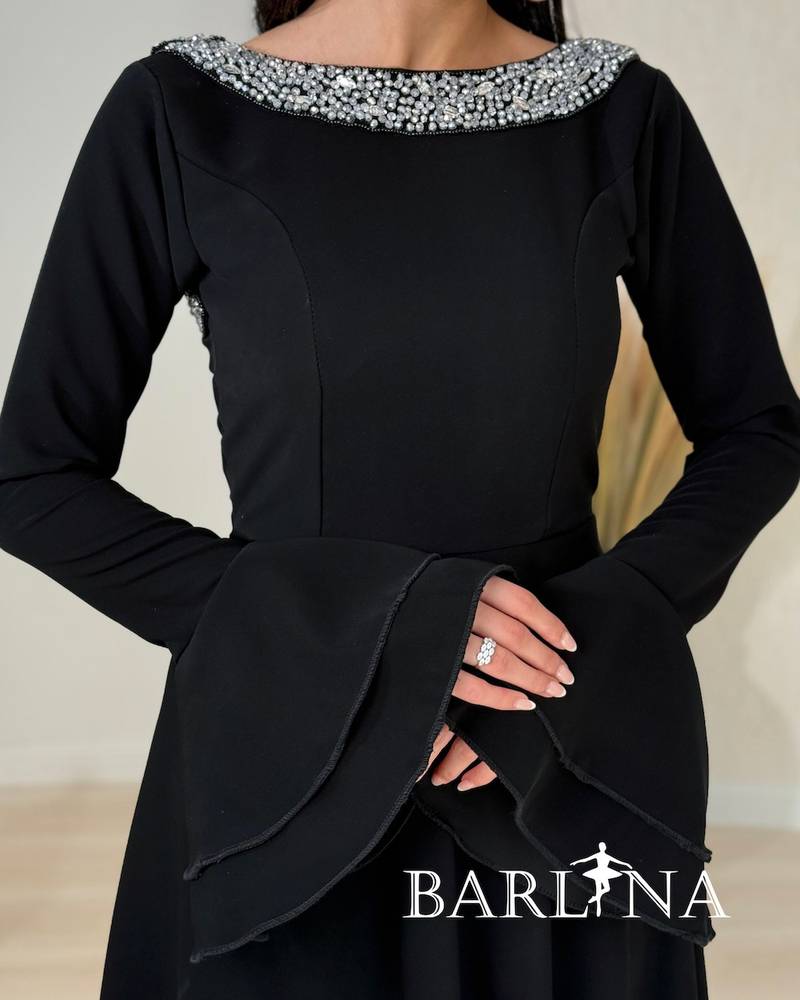 A soft black dress with a crystal-embellished collar.