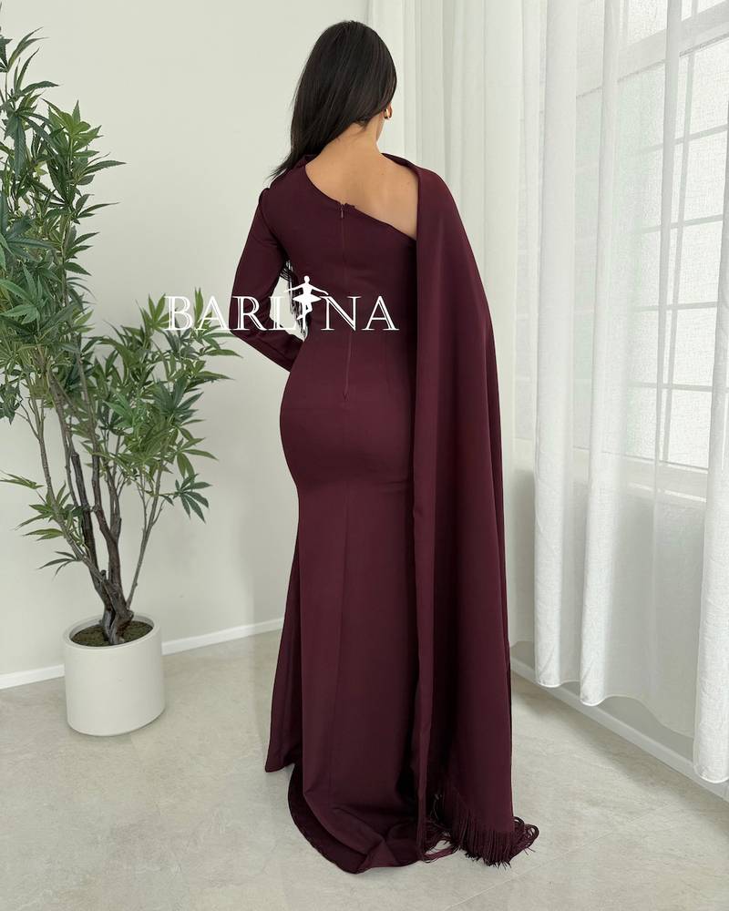 Elegant burgundy dress with a side shawl and tassels
