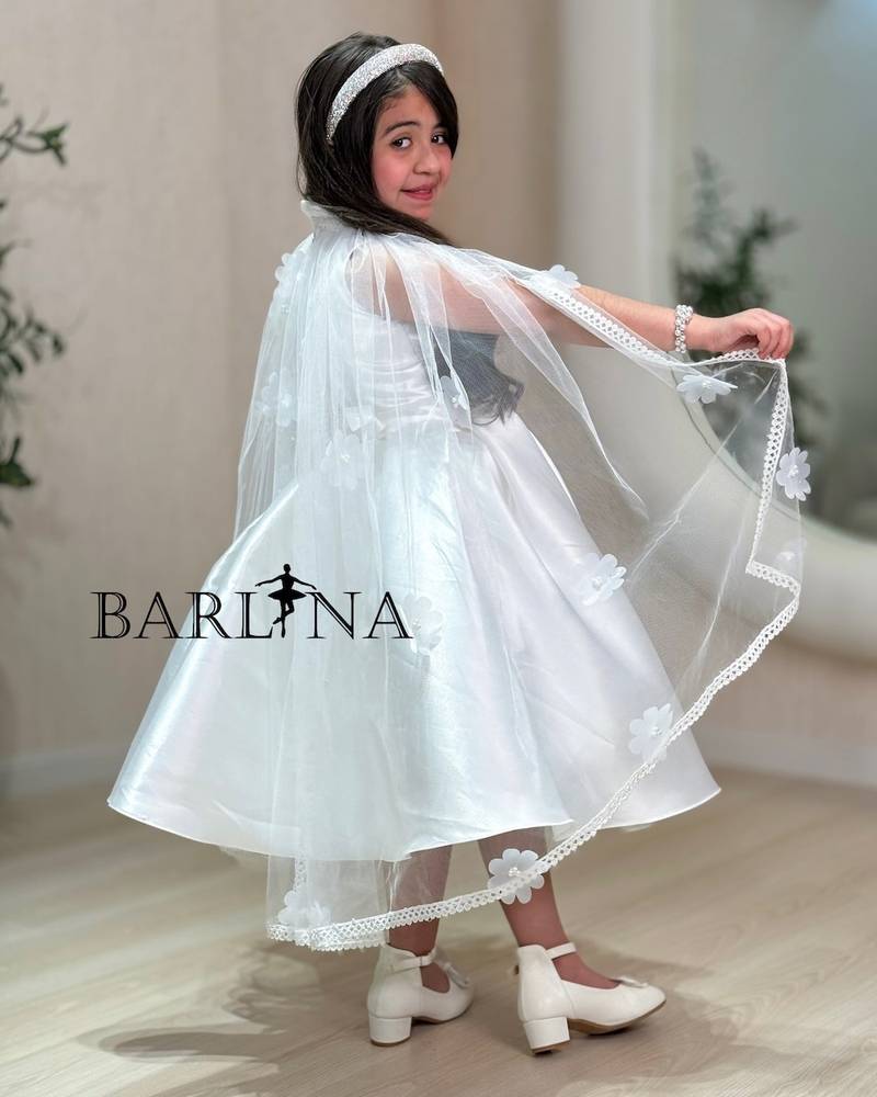 White girl's dress with cape sleeves and embroidered roses