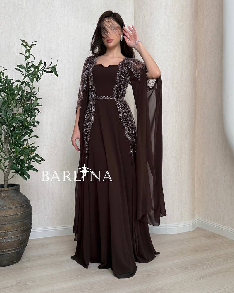 Long brown dress with a sheer cape