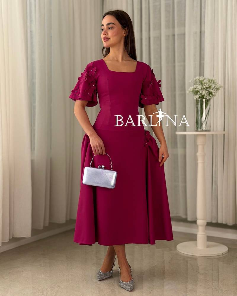Fuchsia fitted dress adorned with roses