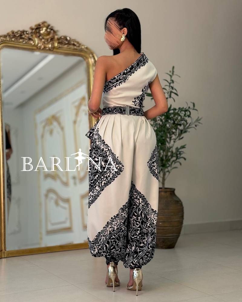 Black and white jumpsuit with a tie at the waist