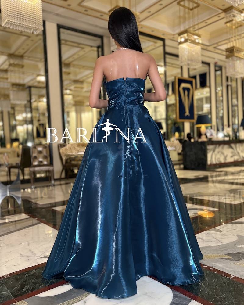 Petrol dress with front bow in shiny fabric