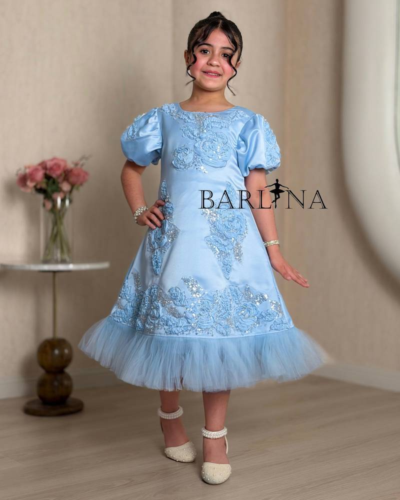 Luxurious blue girls dress with shimmering details