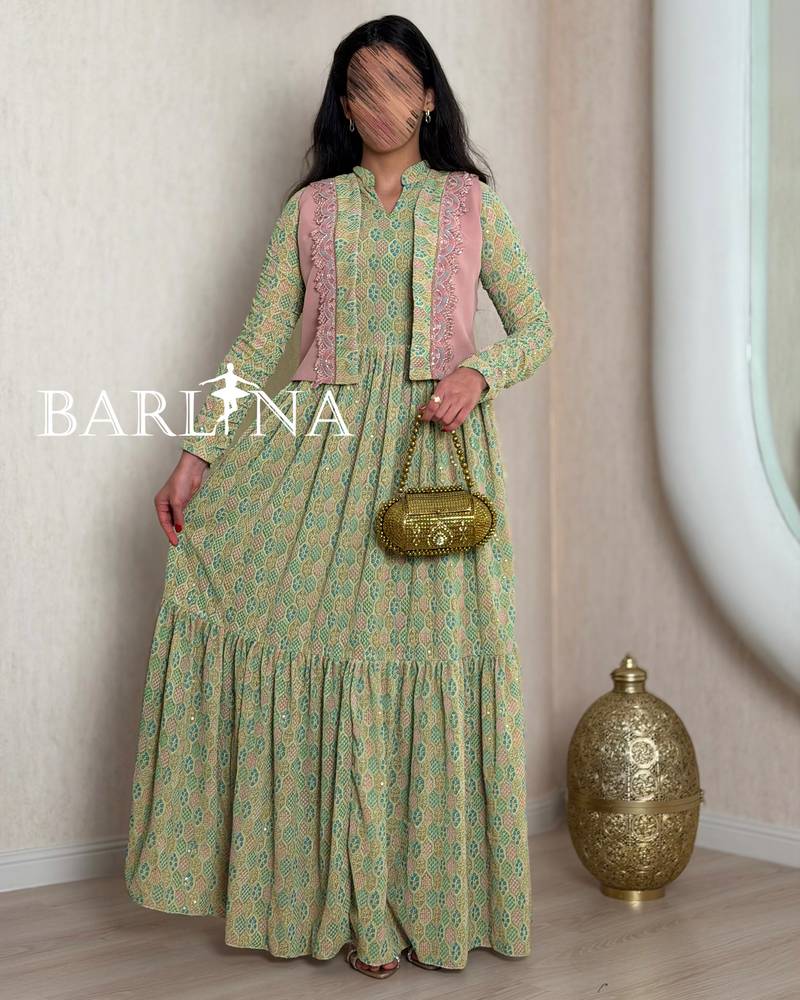 Green patterned jalabiya with a pink jacket