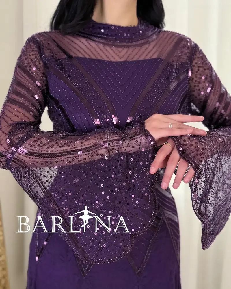 Luxurious purple evening dress with transparent sleeves