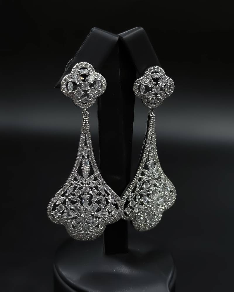 Long evening earrings with a classic royal design