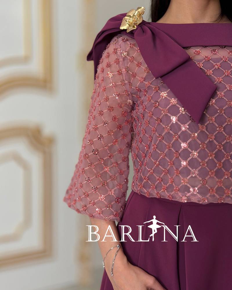 Soft fuchsia embroidered set adorned with a bow