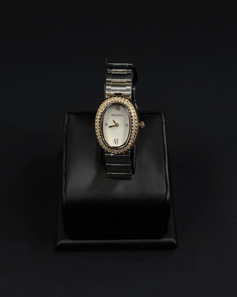 An oval-shaped watch surrounded by crystal