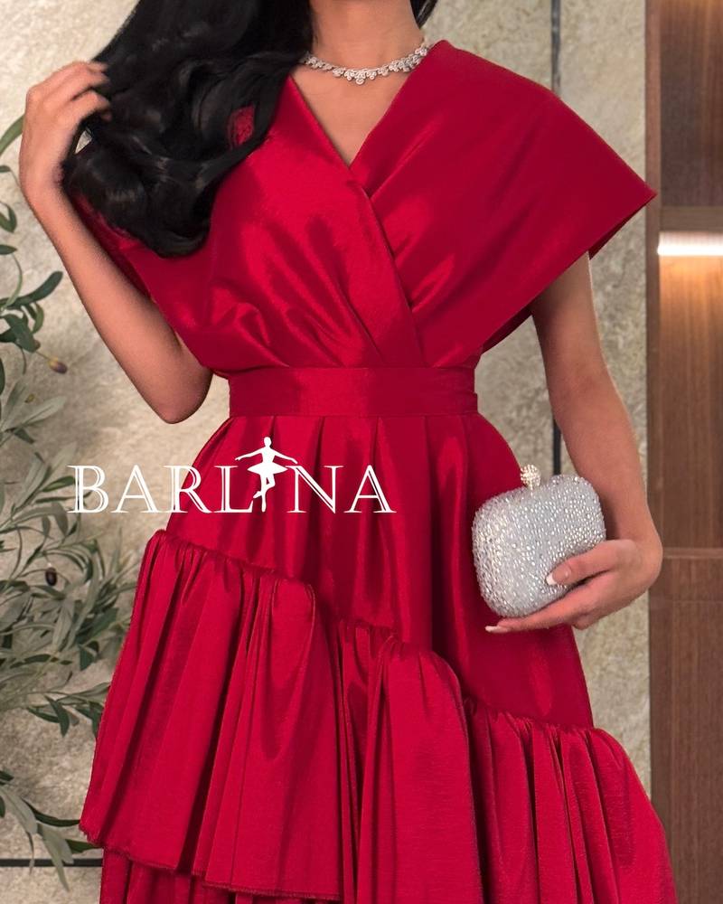 Elegant red layered dress with broad shoulders
