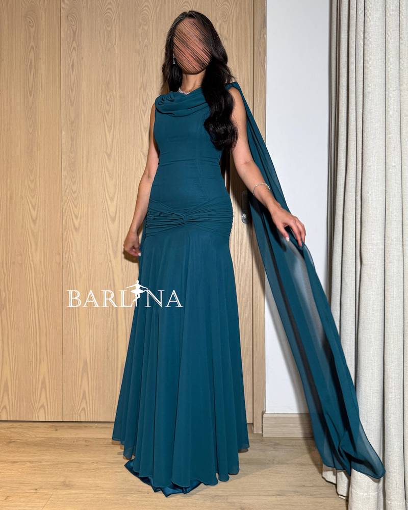 Petrol dress with a draped back cape