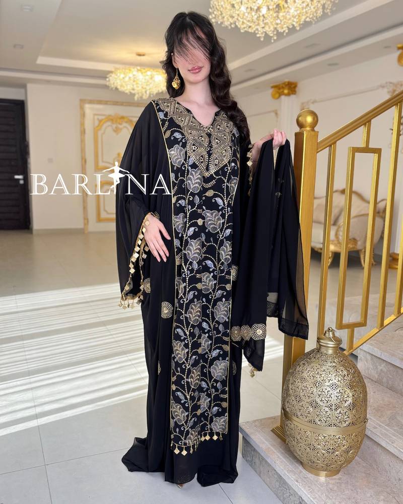 Luxurious jalabiya with gold embroidery and a shawl