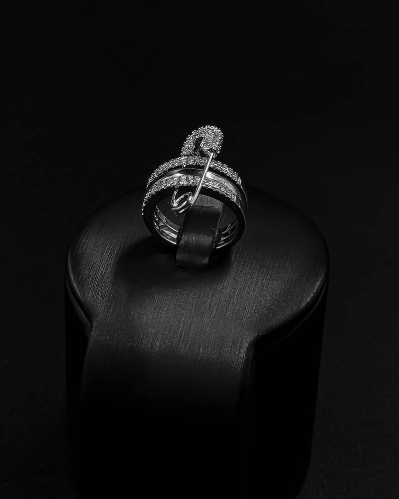 Bracelet and ring designed with crossed studded lines