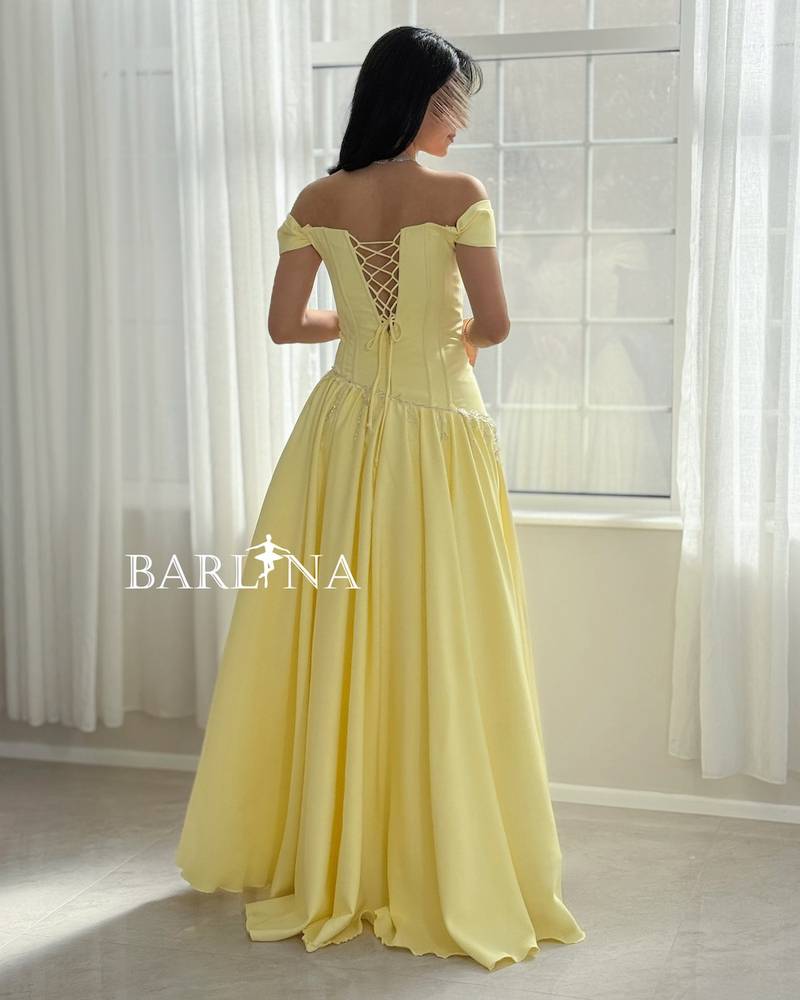 Yellow off-shoulder dress with a fitted corset