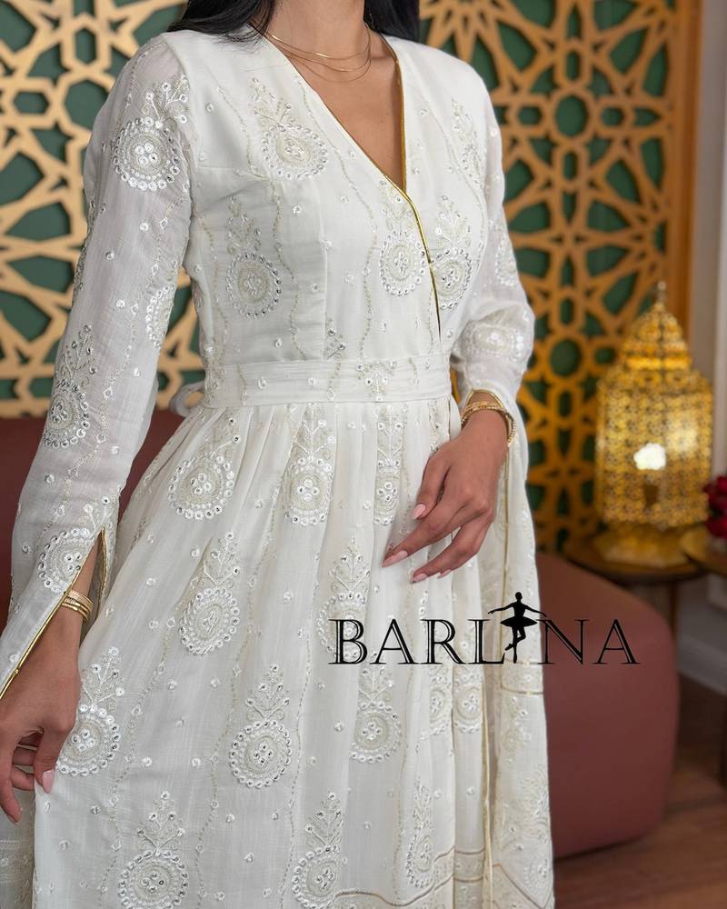 White jalabiya with delicate embroidery and gold accents