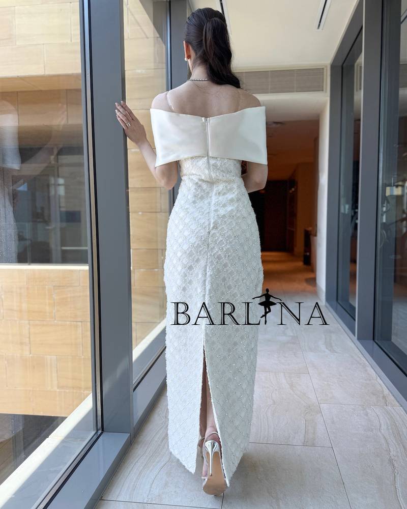 White dress with a slim fit and delicate embroidery