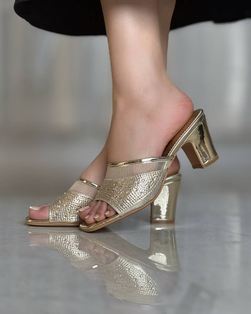 Wide heel studded with sparkling gems