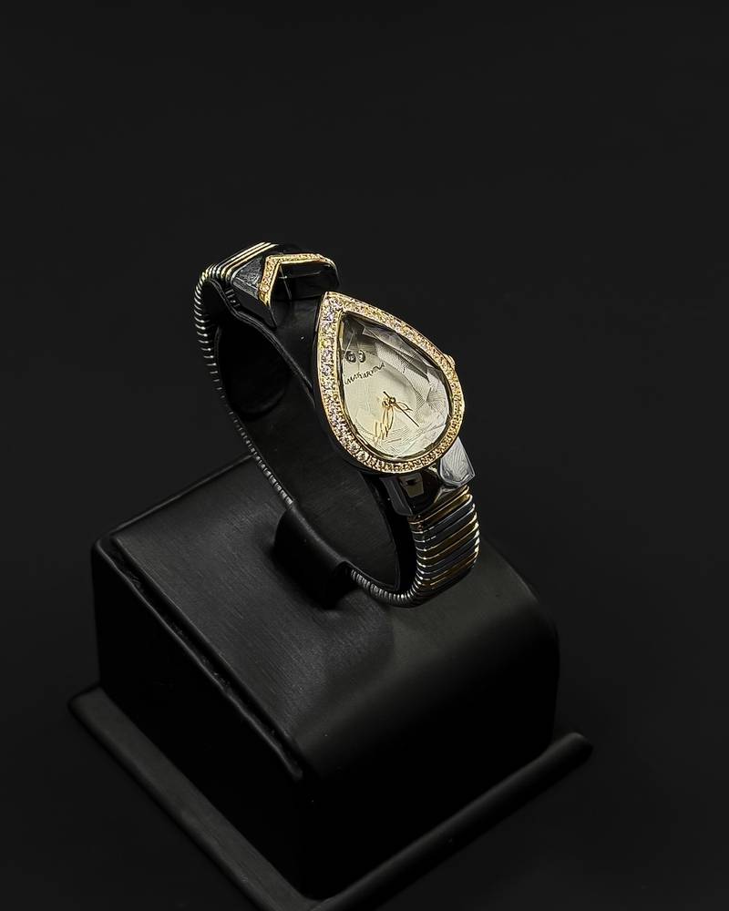 A luxurious women's watch in the shape of a teardrop