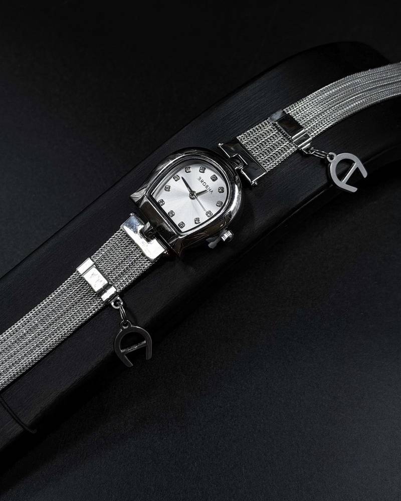 Elegant women's watch adorned with a charm